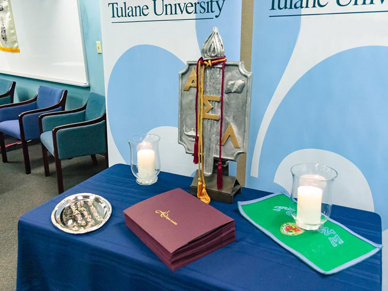 Table displaying awards and items honoring Tulane School of Professional Advancement