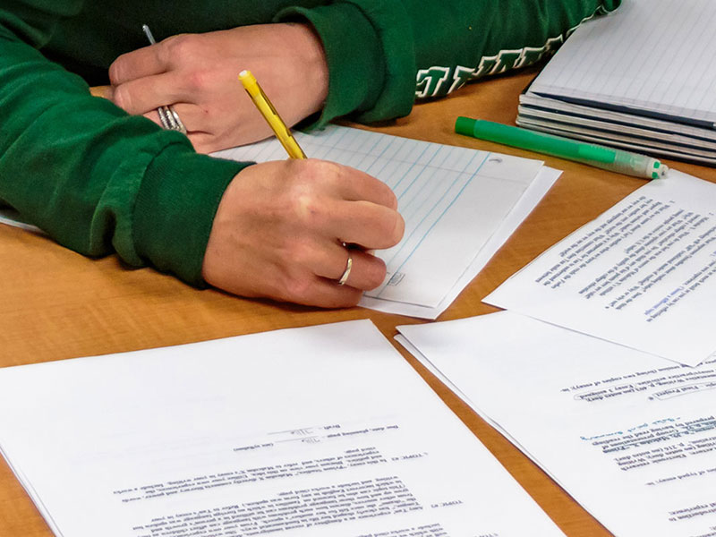 Graduate student filling out transfer paperwork for Tulane SoPA