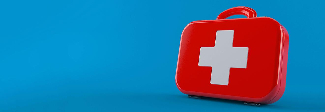 A red first aid kit representing items to pack in a hurricane go-bag by Tulane School of Professional Advancement in New Orleans, LA