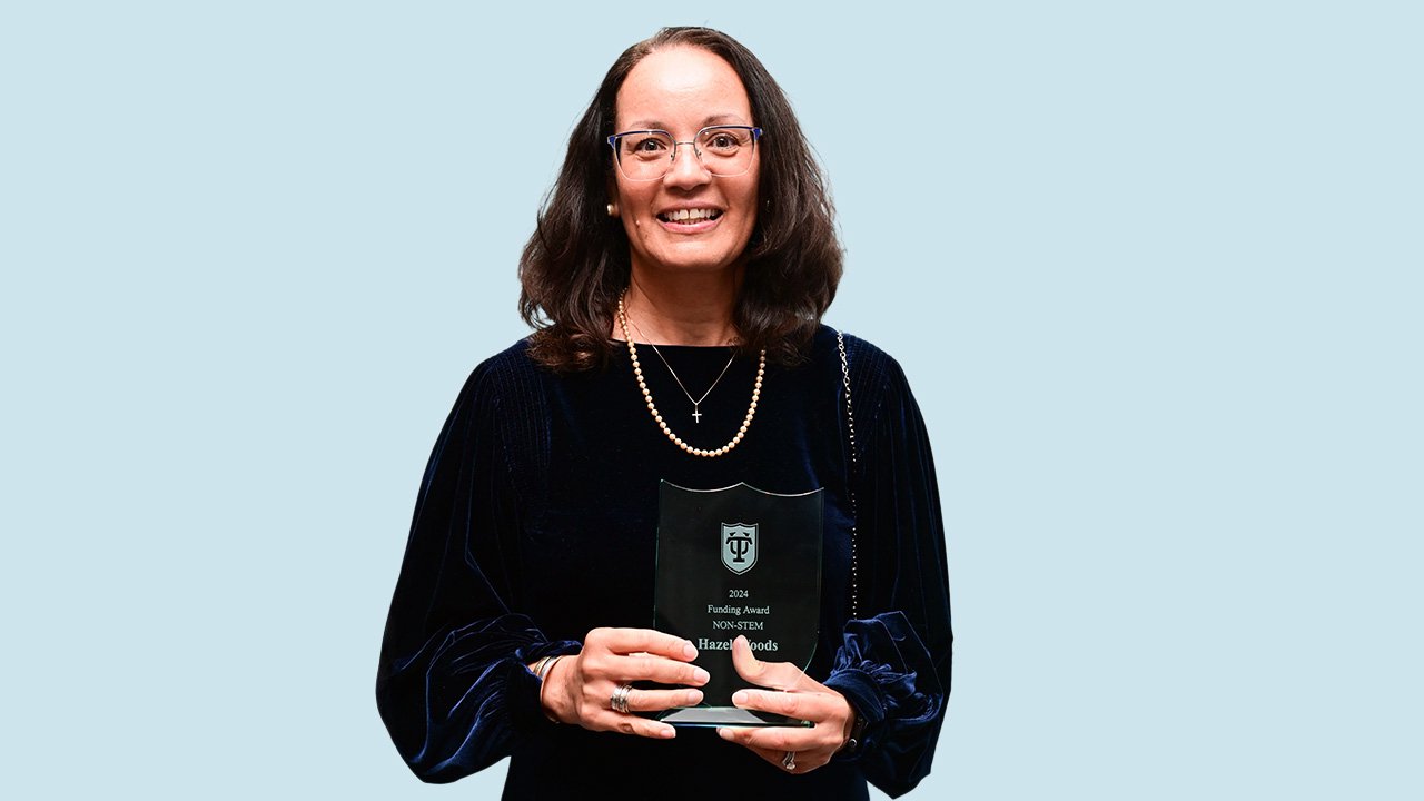 Hazel with award