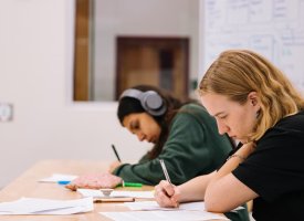 Transfer students working in a classroom - Tulane School of Professional Advancement