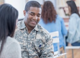 A make veteran talking to a woman representing tips for student veterans by Tulane School of Professional Advancement in New Orleans, LA