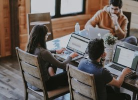 A group of people on their laptops