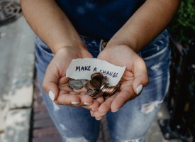 Hands holding change and a note that states 'Make a change'