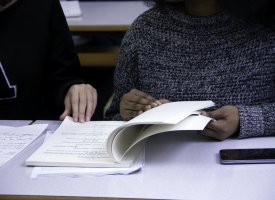 Students looking over notes in class