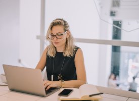 A woman working on a laptop