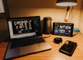 An at-home workspace with a laptop during a video call