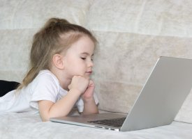 A child looking at a laptop