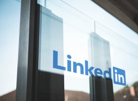 The LinkedIn logo on a window