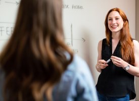 Graduate transfer student at a whiteboard - Tulane School of Professional Advancement