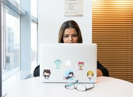 Woman in IT typing at laptop - Tulane School of Professional Advancement